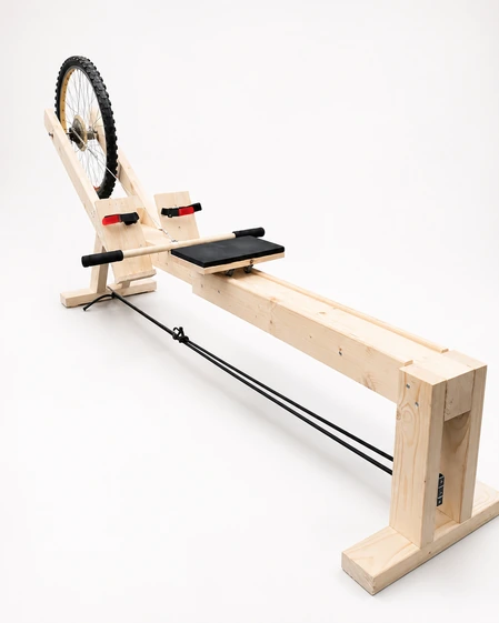 Full-length view of the rowing machine and wooden seat rails.